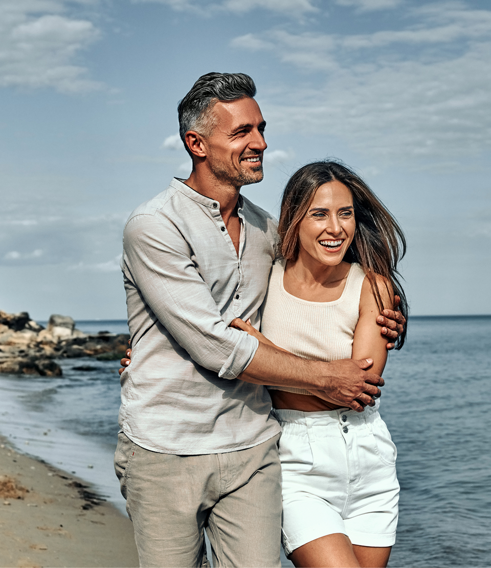 A couple standing on the beach