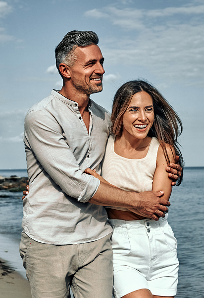 A couple standing on the beach