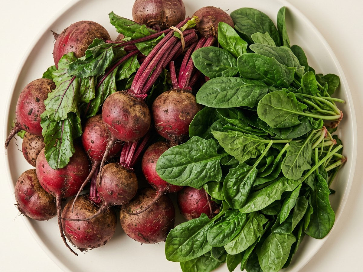 Plate heaped with fresh beets and spinach