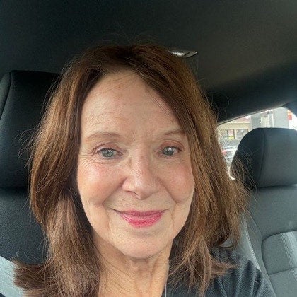 Cheryl B., 78, photographed in her car.