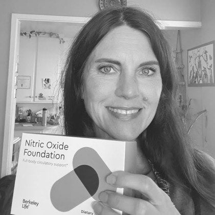 Sequoia K. at home, holding her box of Berkeley Life Nitric Oxide.